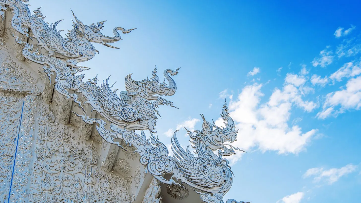 The dazzling white facade of Wat Rong Khun, the White Temple in Chiang Rai