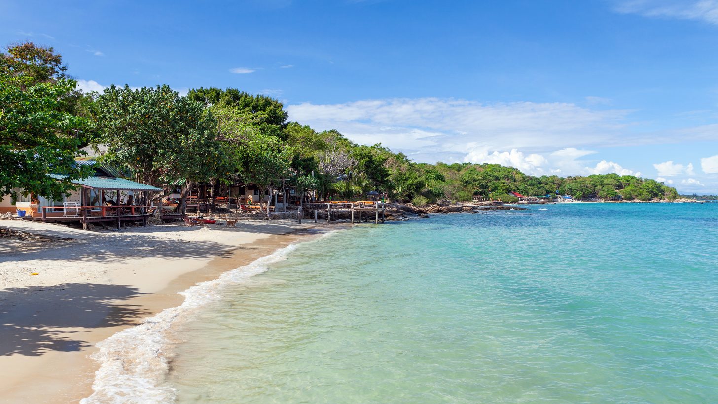 Waves breaking on a white sand beach on Koh Samet inside Khao Laem Ya national park, Rayong
