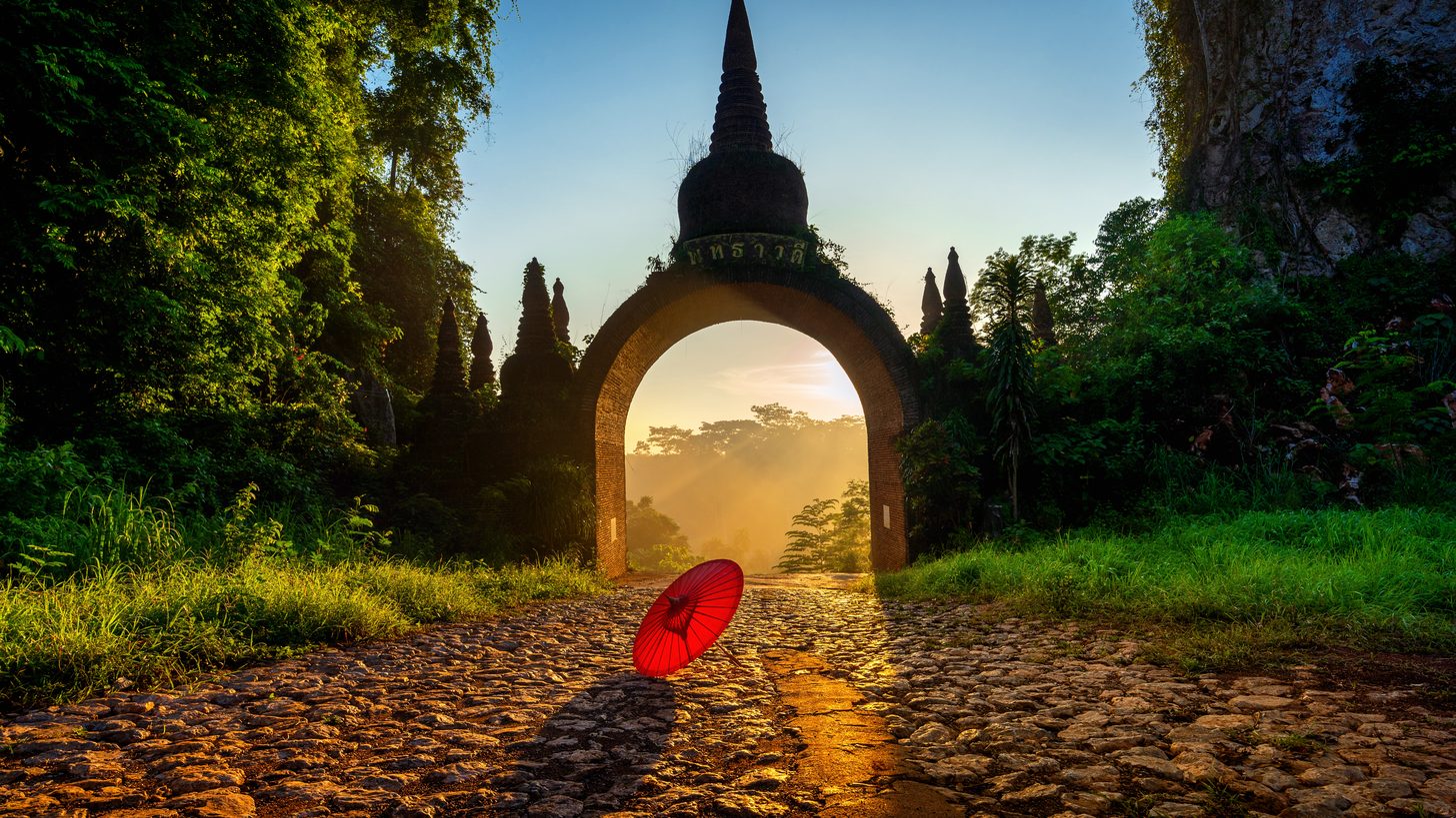 The gate of Khao Na Nai Luang Dharma Park at sunrise in Surat Thani, southern Thailand