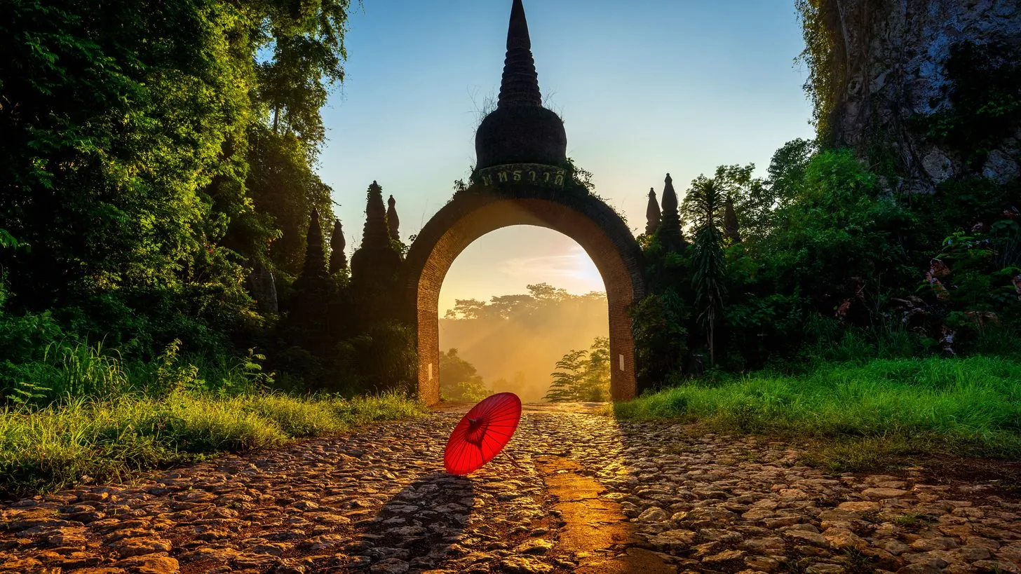 The gate of Khao Na Nai Luang Dharma Park at sunrise in Surat Thani, southern Thailand