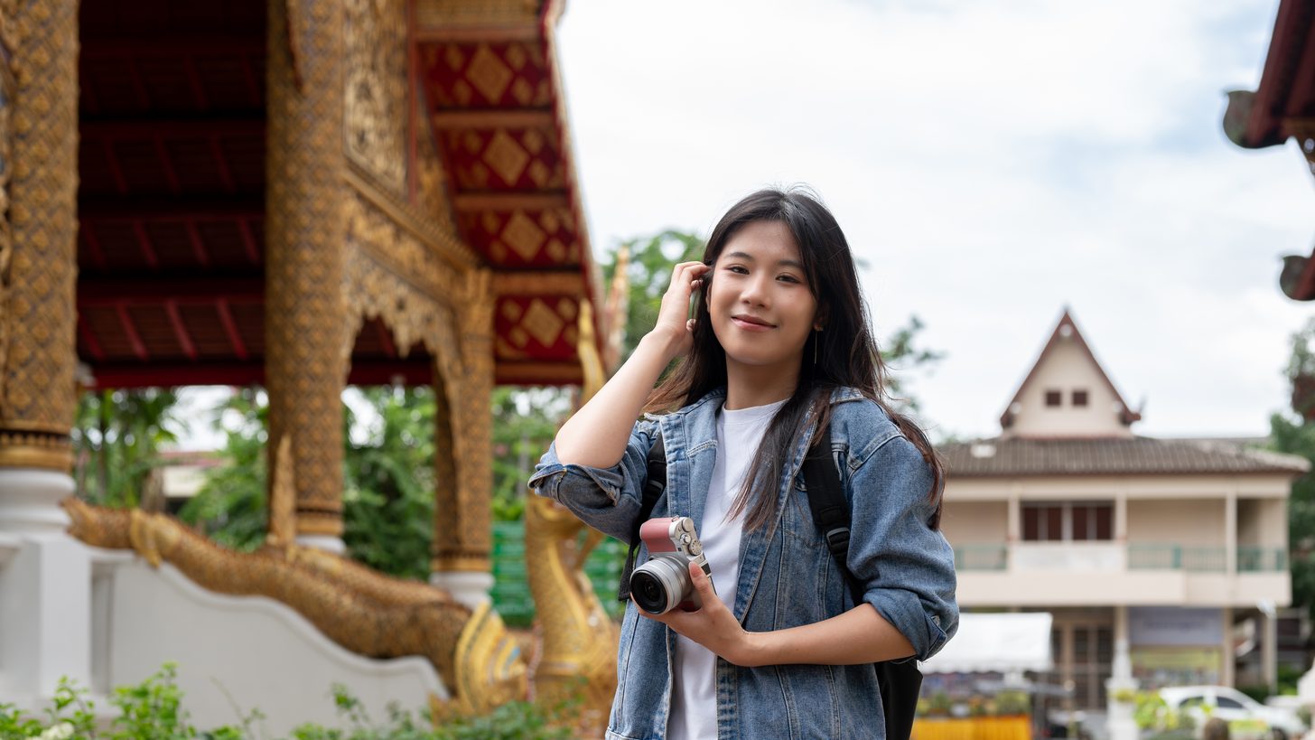 A solo female traveller visiting a temple in Chiang Mai