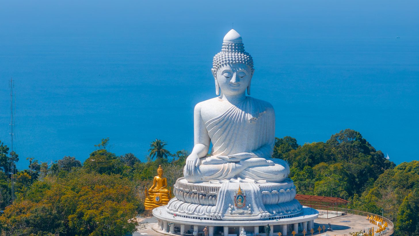 The white Big Buddha on its hilltop overlooking the sea in Phuket