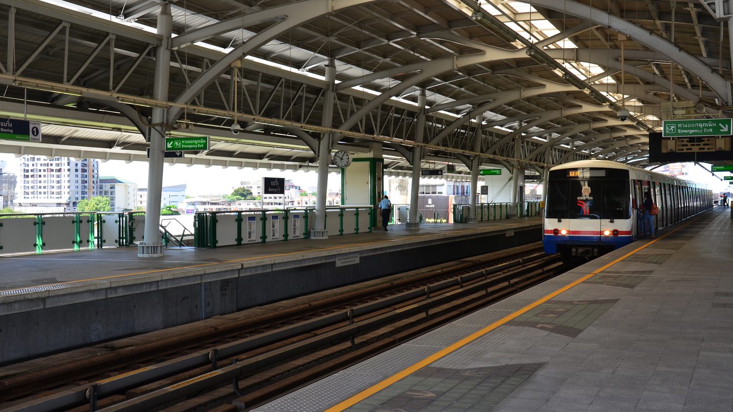 BTS Skytrain arriving at an elevated Bangkok station