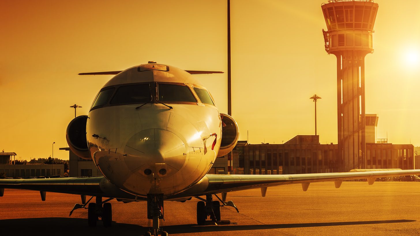 Aircraft at an airport at sunset