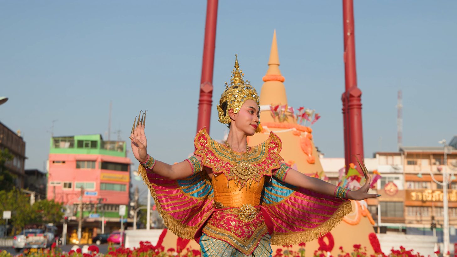 Local Thai cultural festival with crowds and traditional decorations