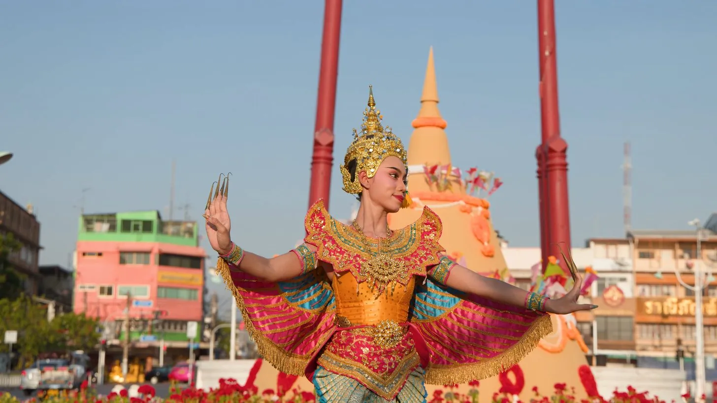 Local Thai cultural festival with crowds and traditional decorations