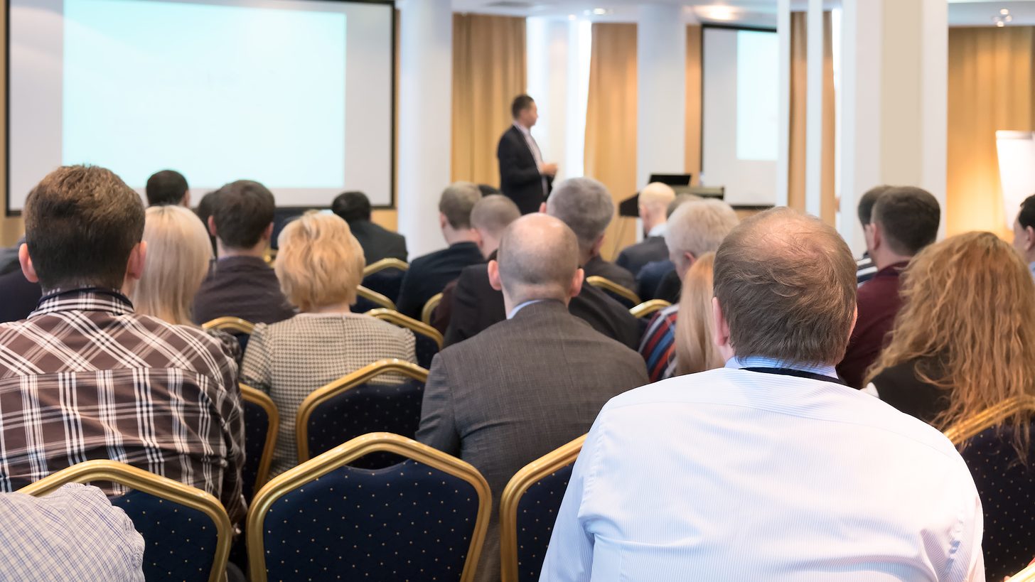 Delegates seated at a business conference