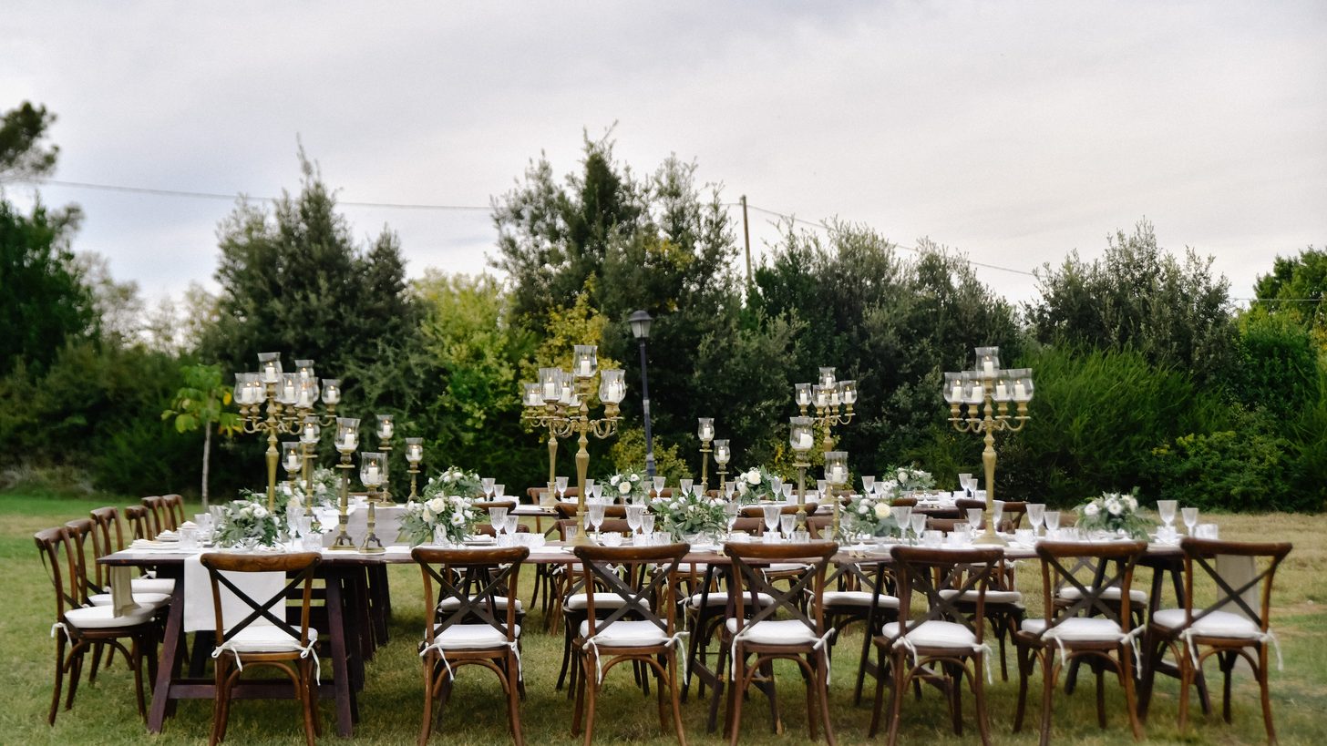 An outdoor event dinner set up in a garden