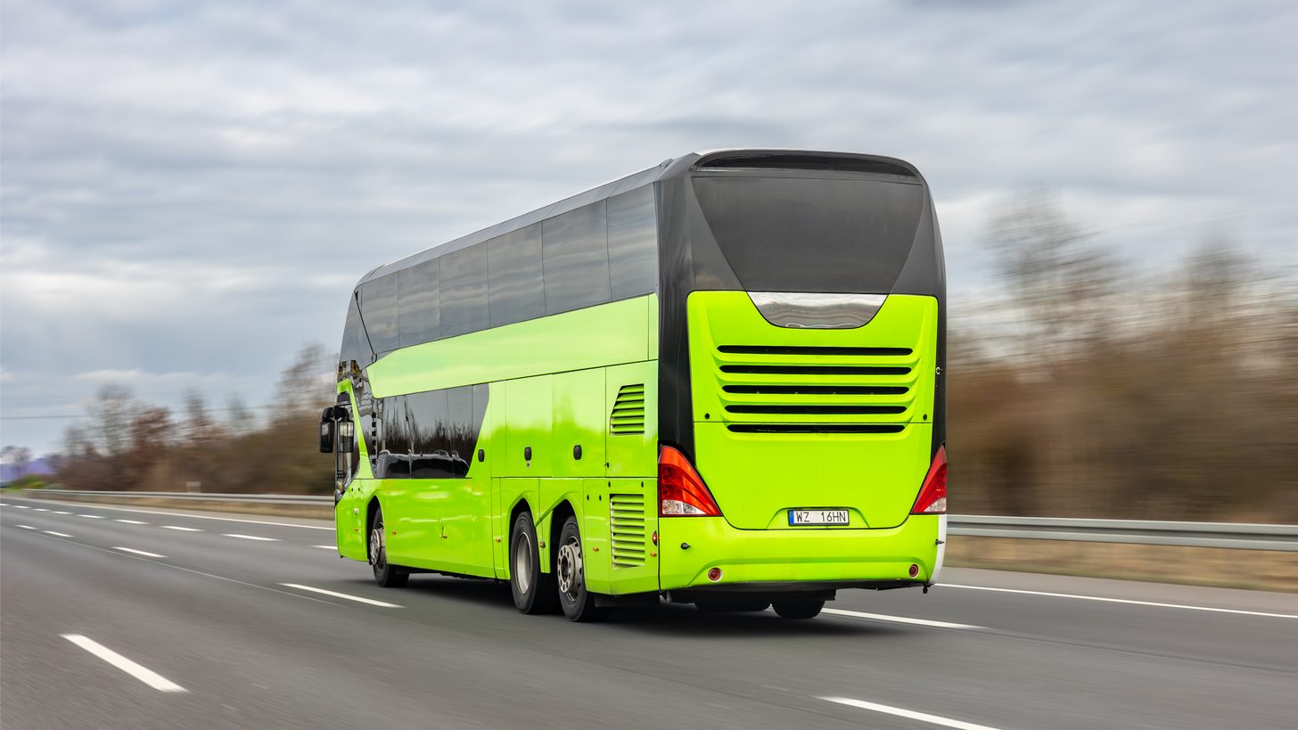 A modern tourist coach on a Thai highway