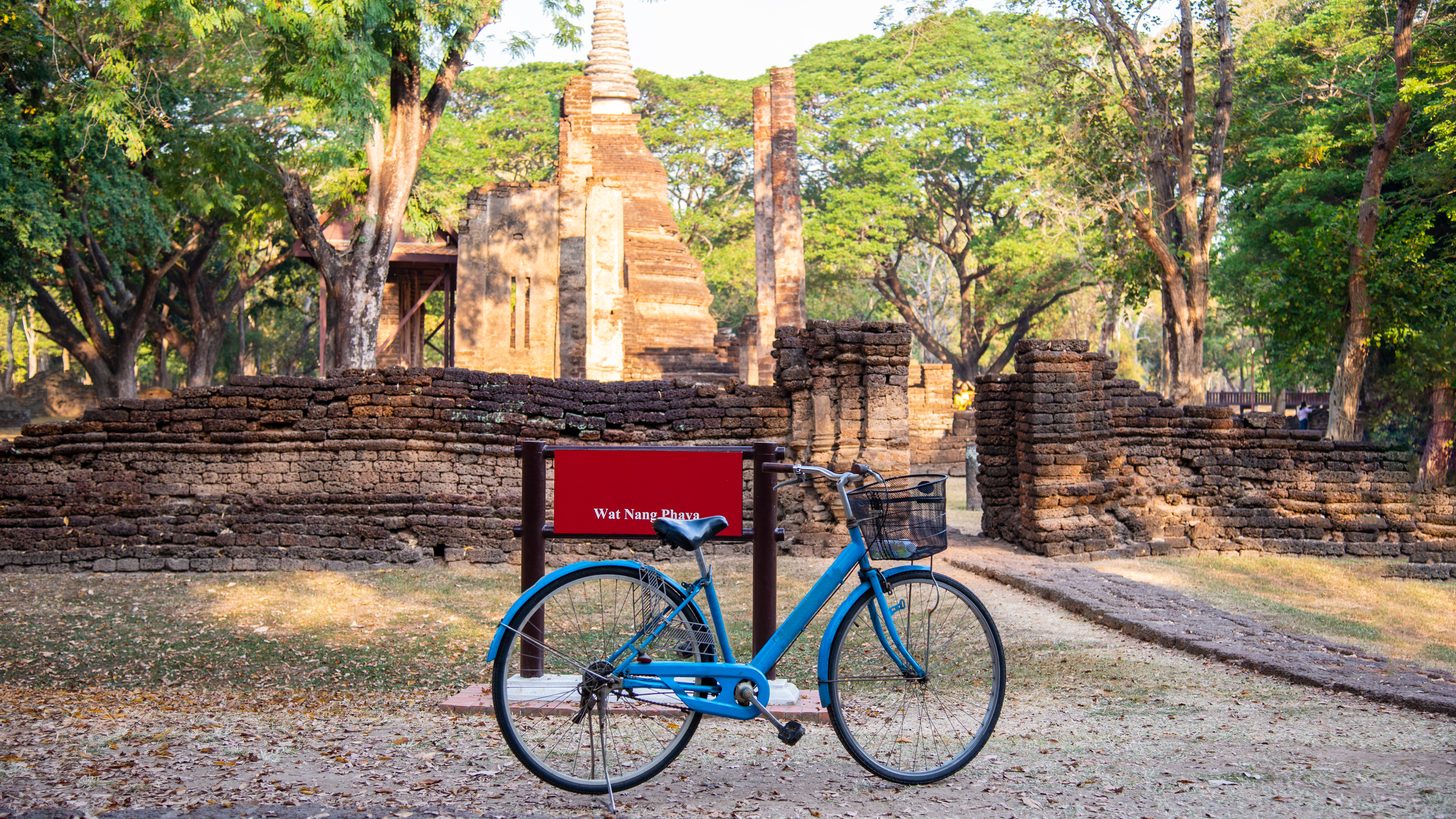 A bicycle beside ancient temple ruins in the Sukhothai region