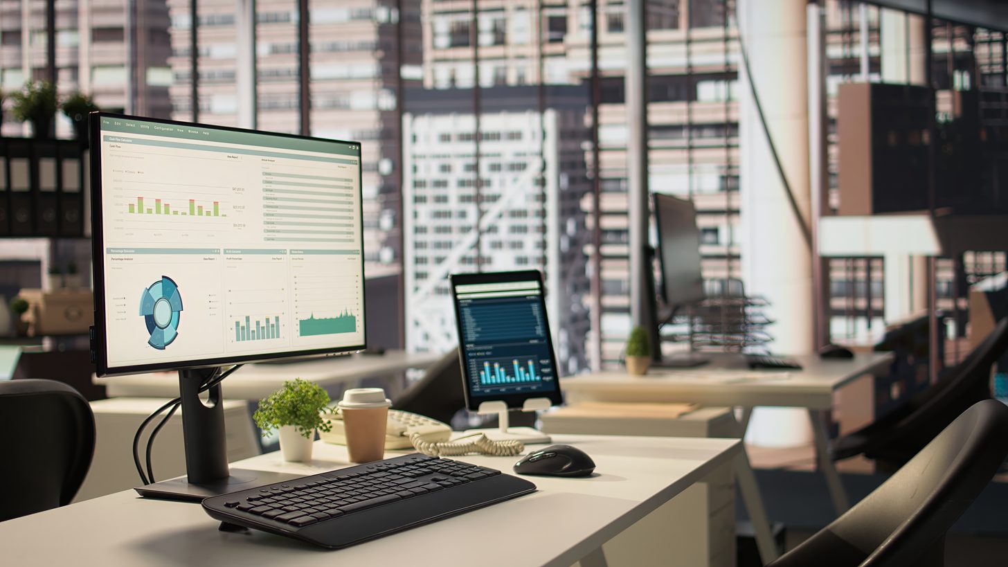 A modern office workstation with a computer at a clean desk
