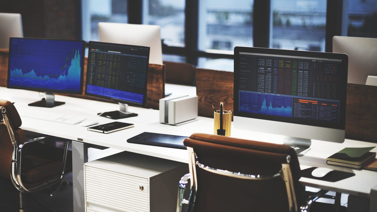 A tidy contemporary office workspace with desk and supplies