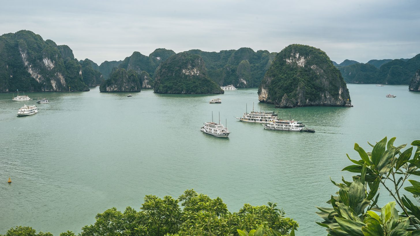 Aerial view of limestone karst islands and boats in Halong Bay, Vietnam