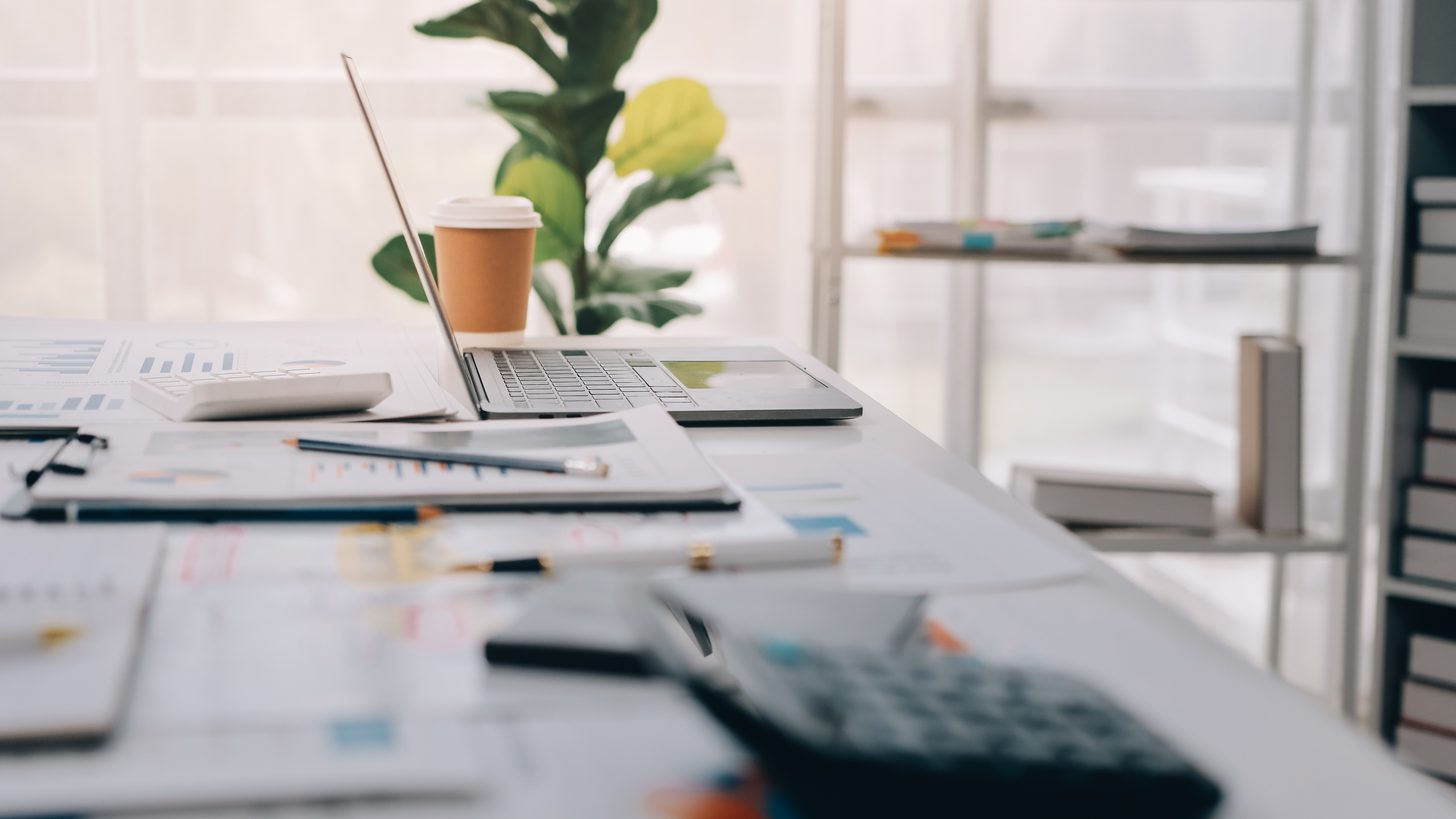 An advisor walking two clients through a written plan at an office table
