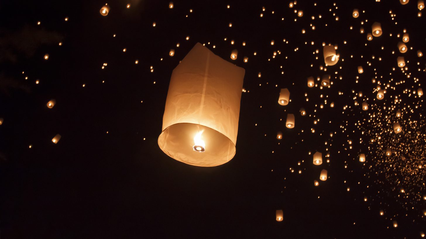 Sky lanterns released into the night over Chiang Mai
