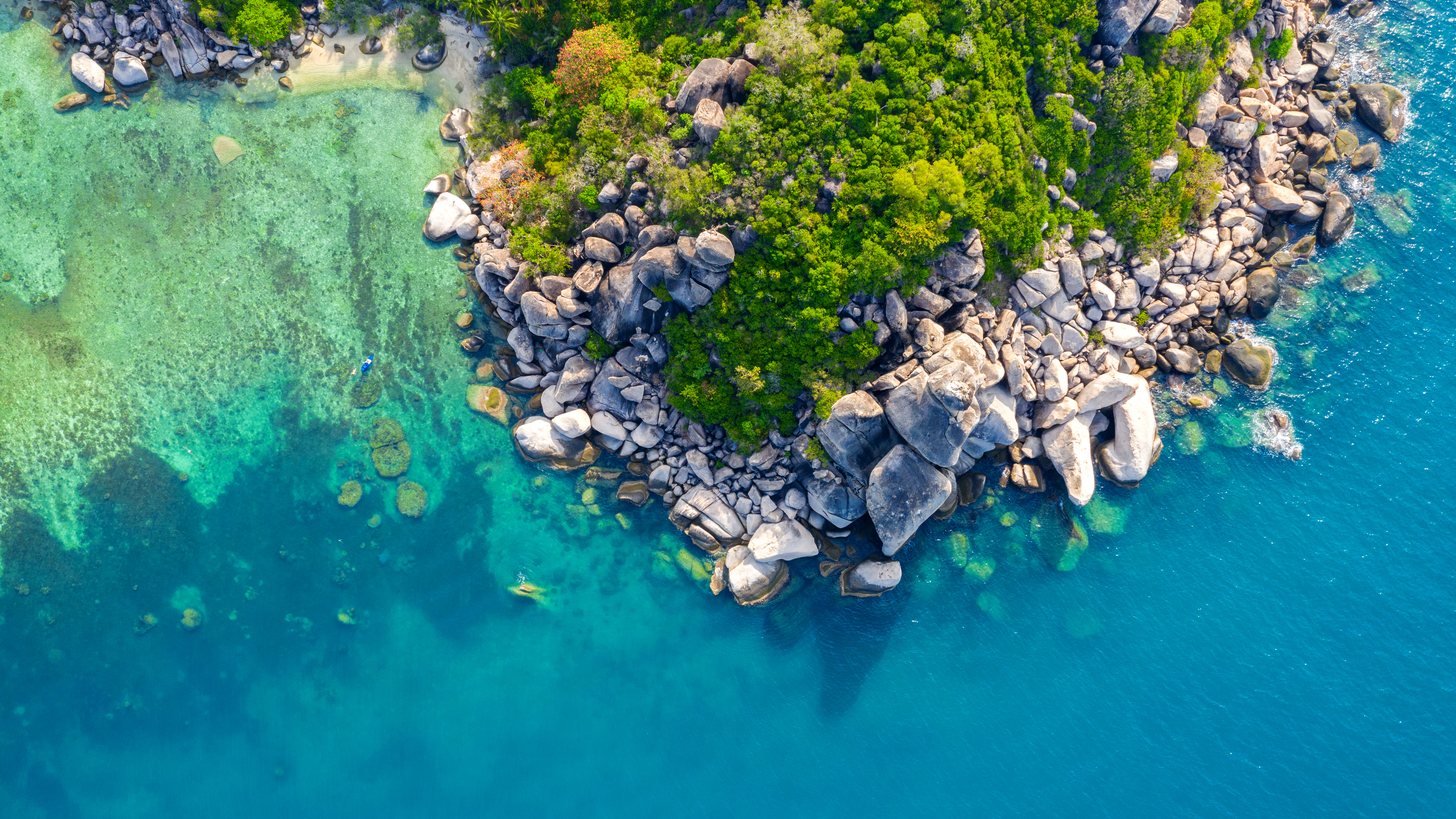 Aerial view of the seashore and shallow reef flats at Koh Tao island on Thailand's Gulf coast