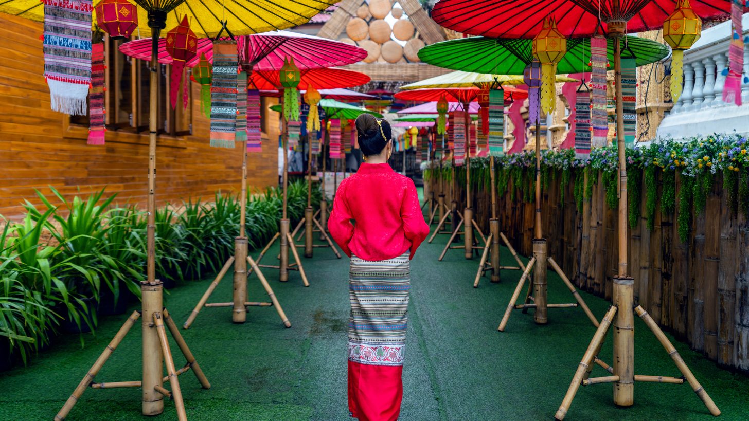 Women in traditional northern Thai dress at a temple