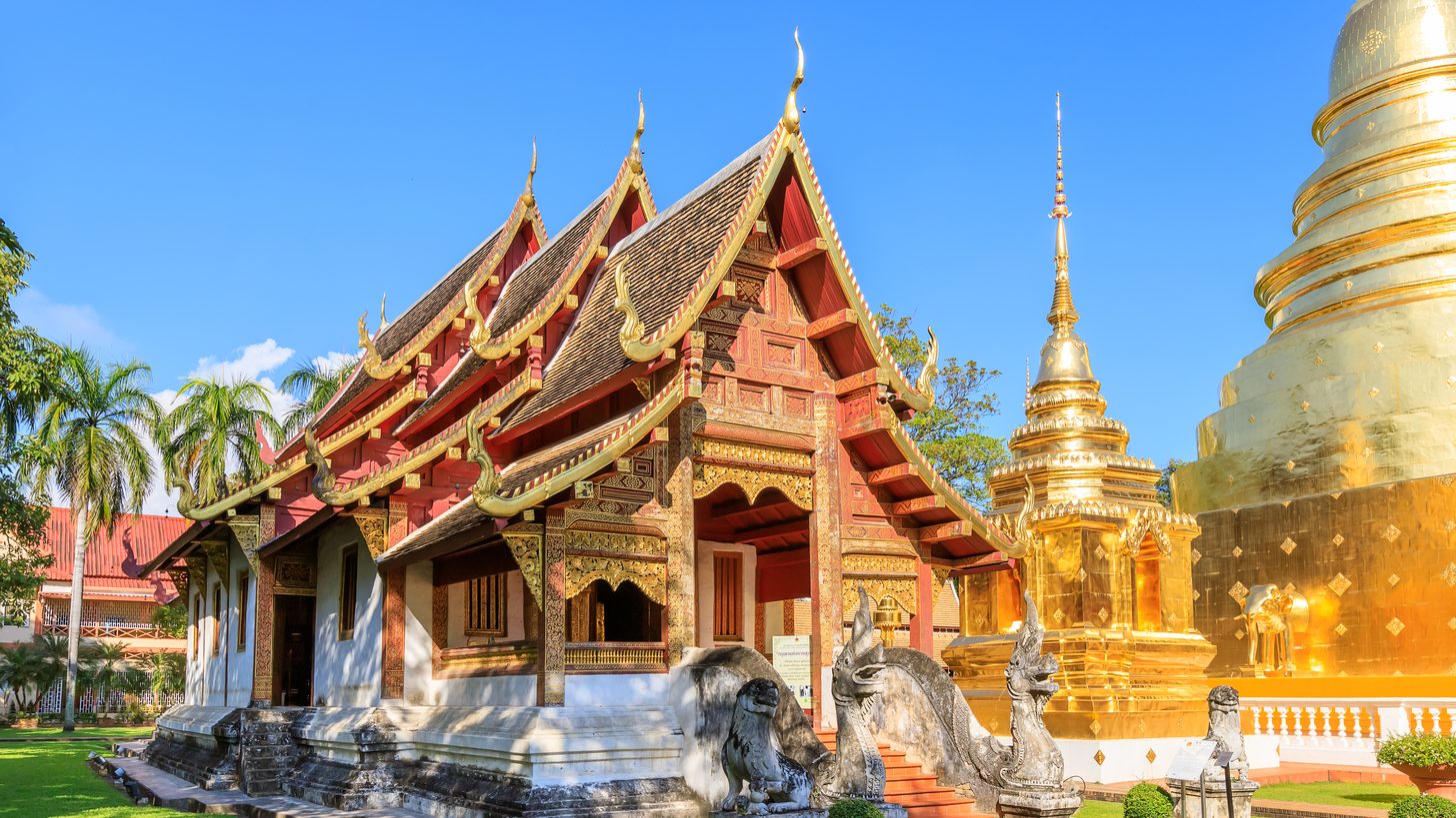 A golden pagoda and temple chapel in northern Thailand