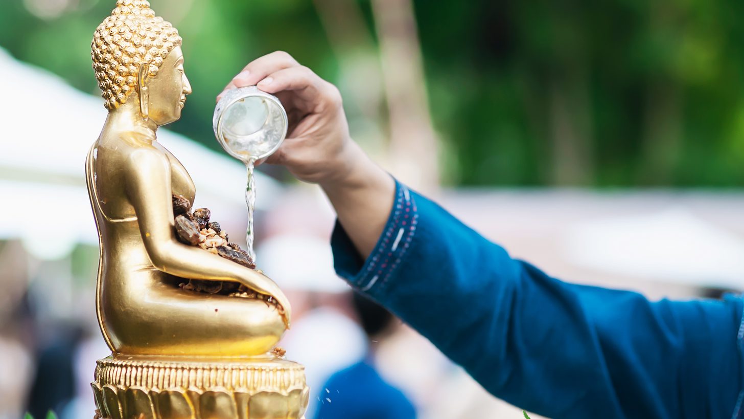 People taking part in a traditional Songkran ceremony