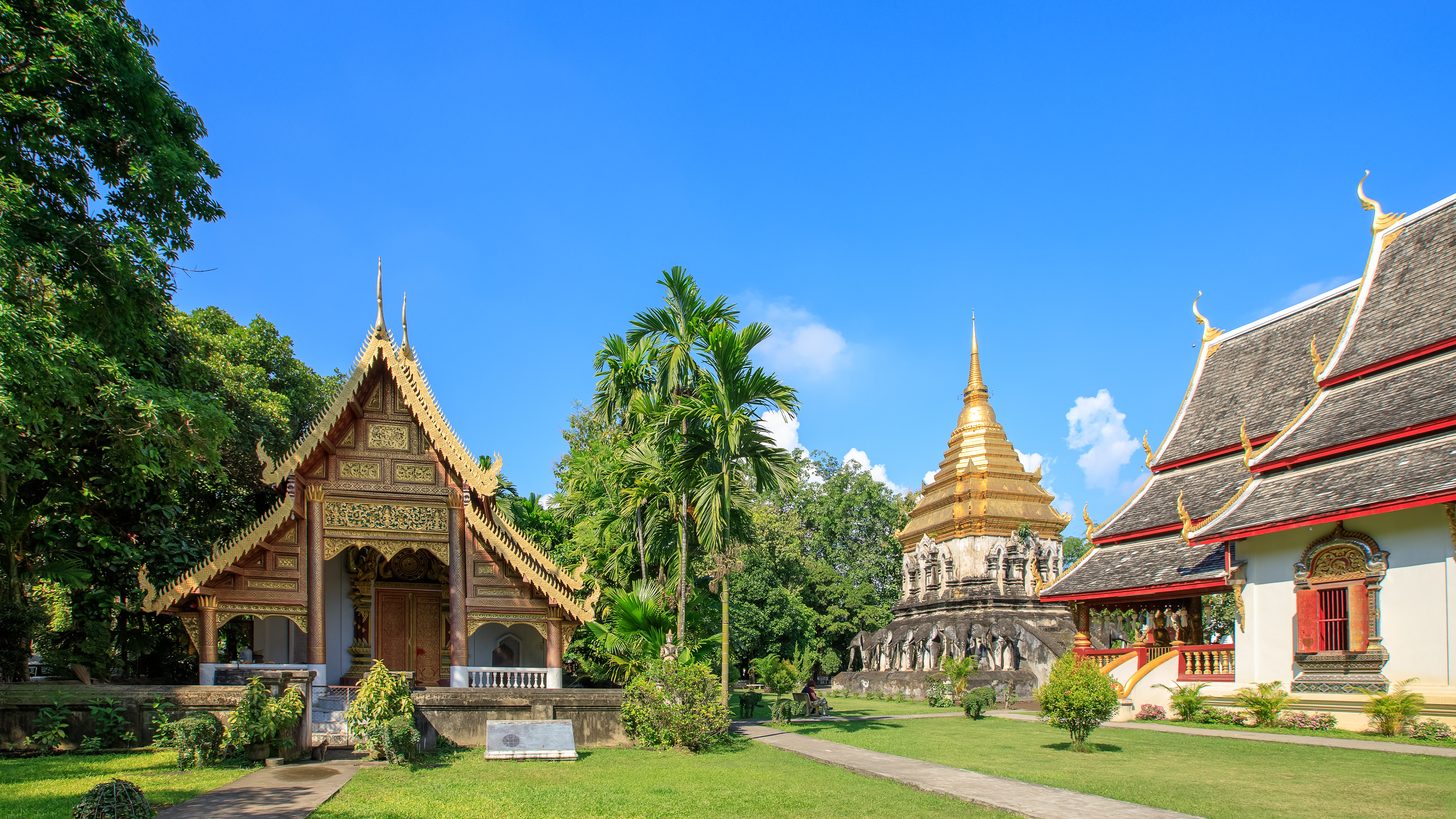 Golden pagoda and chapel at Wat Chiang Man, a historic temple in Chiang Mai