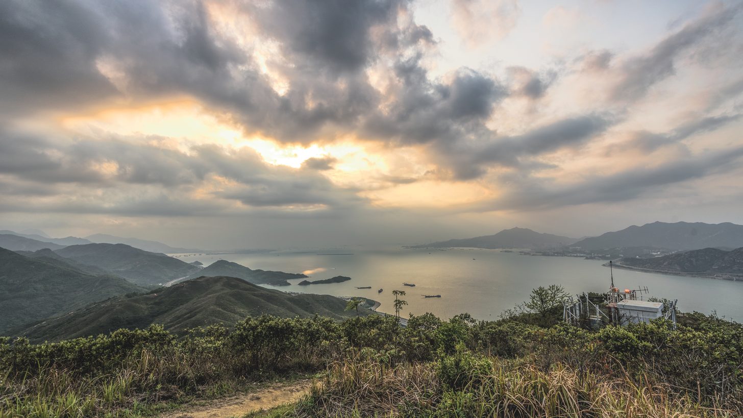 A viewpoint over green hills and limestone formations in southern Thailand