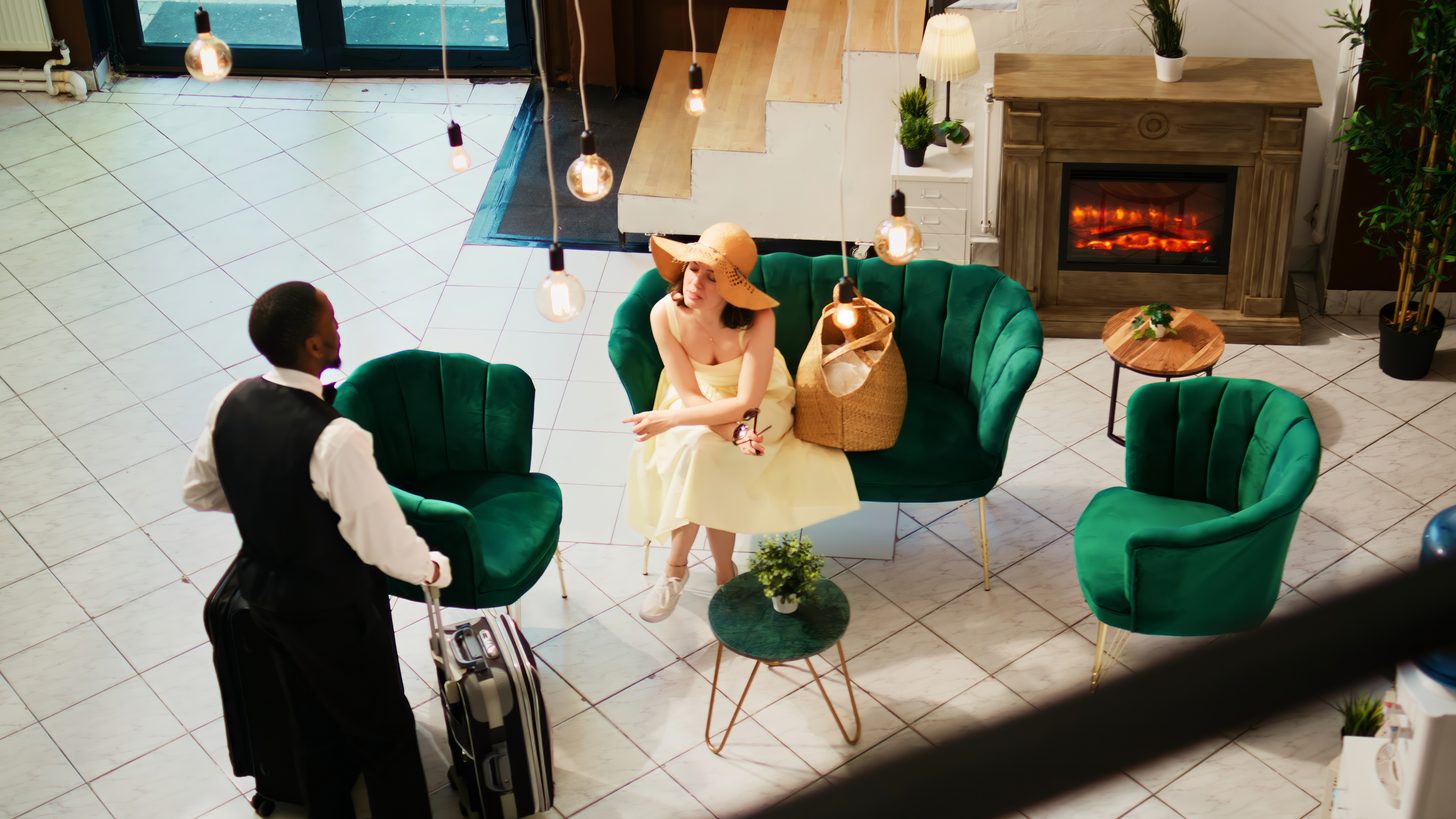 A traveller waiting in a hotel lounge before check-in