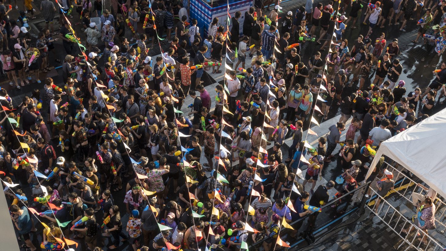 Crowds celebrating Songkran on a street in Bangkok