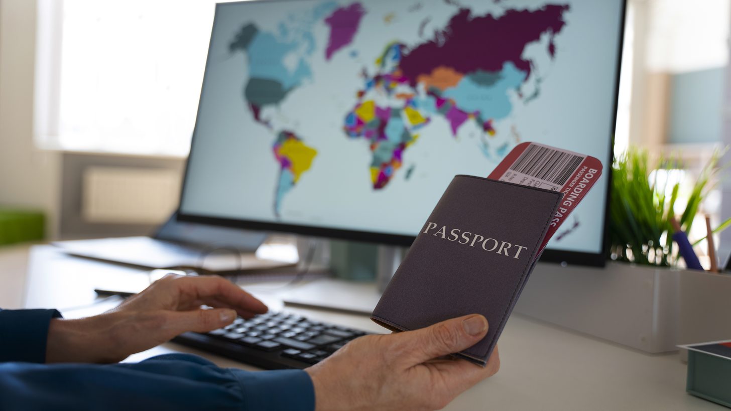 A traveller holding passports before a trip