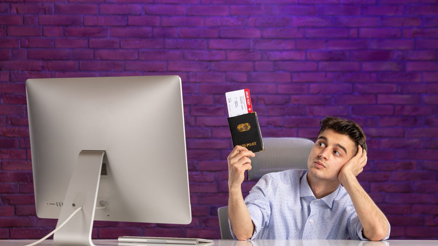 A desk with a passport and travel documents laid out