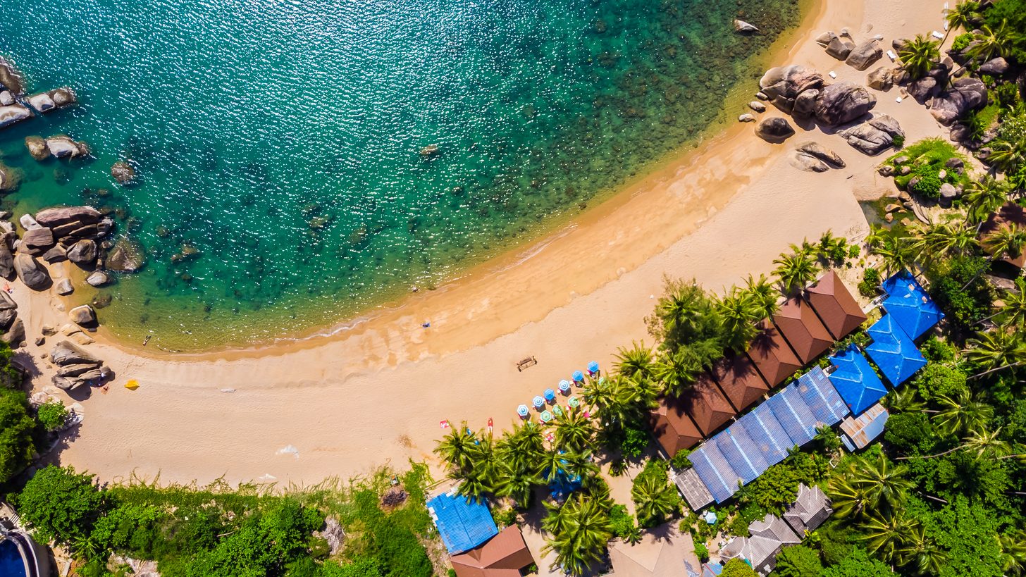 Aerial view of a beach and palm trees on Koh Samui