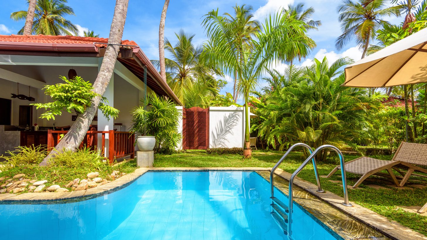 A private villa with a pool in a tropical setting