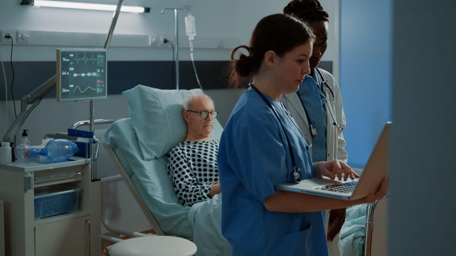 Hospital staff reviewing medical test results together