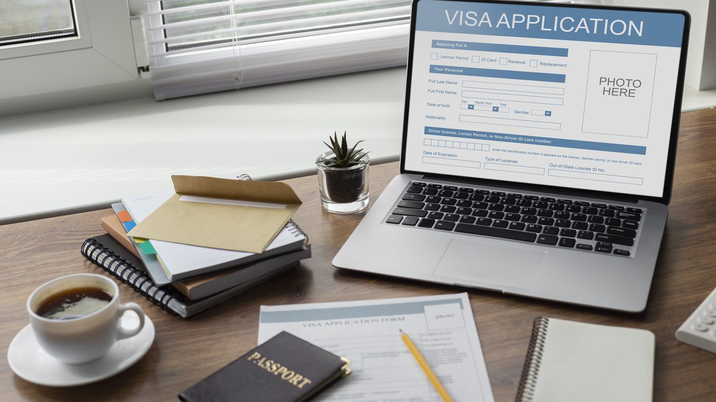 A visa application form open on a laptop screen