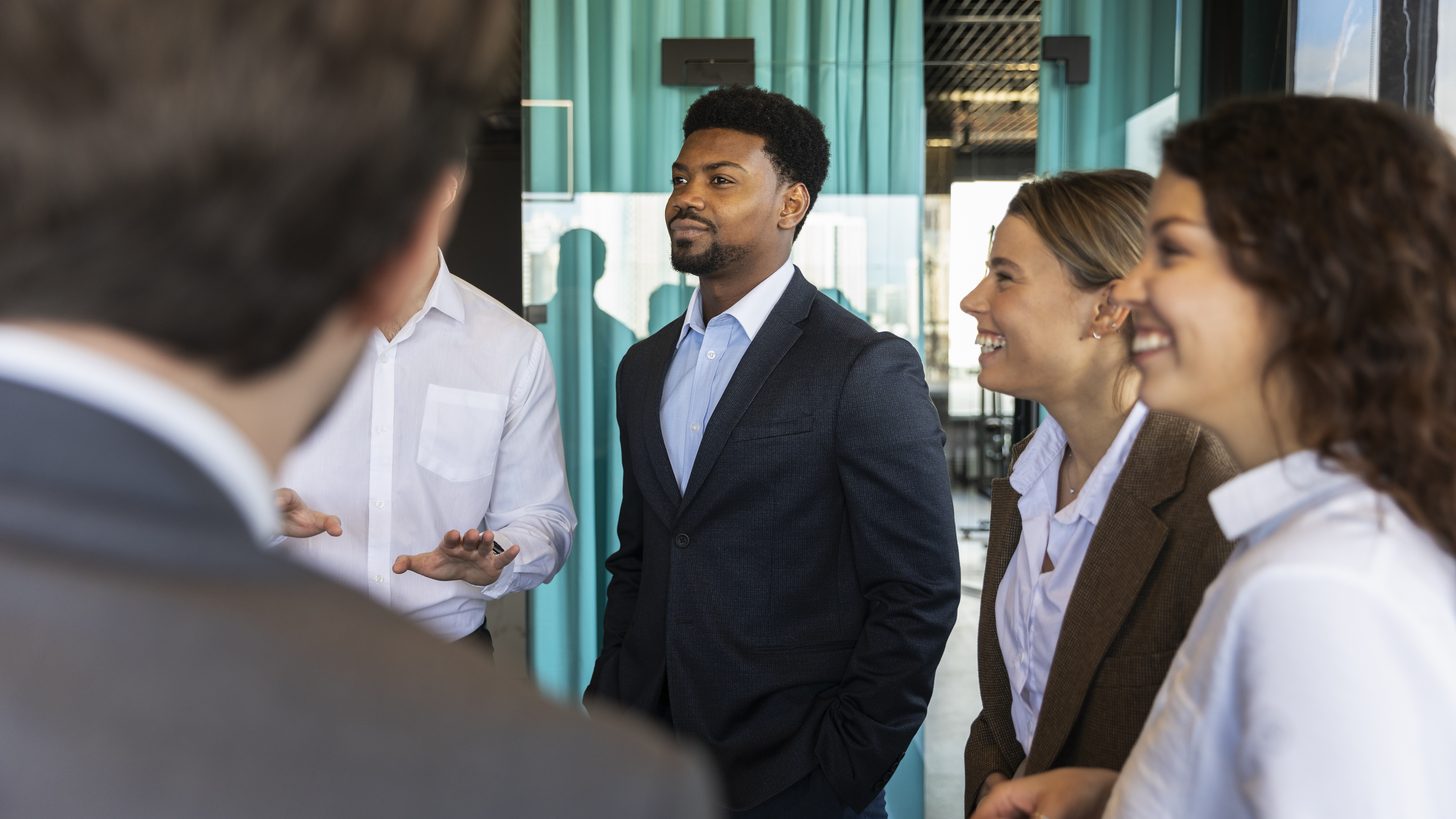 Business travellers in conversation at a networking event