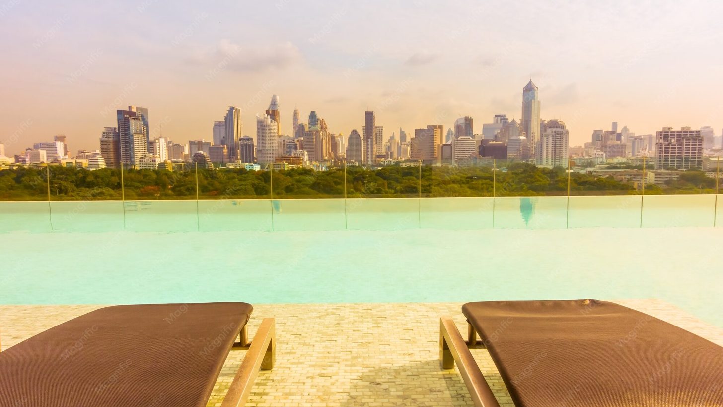A residential pool with a city skyline behind it, the kind of condominium setting the short-stay rules are aimed at