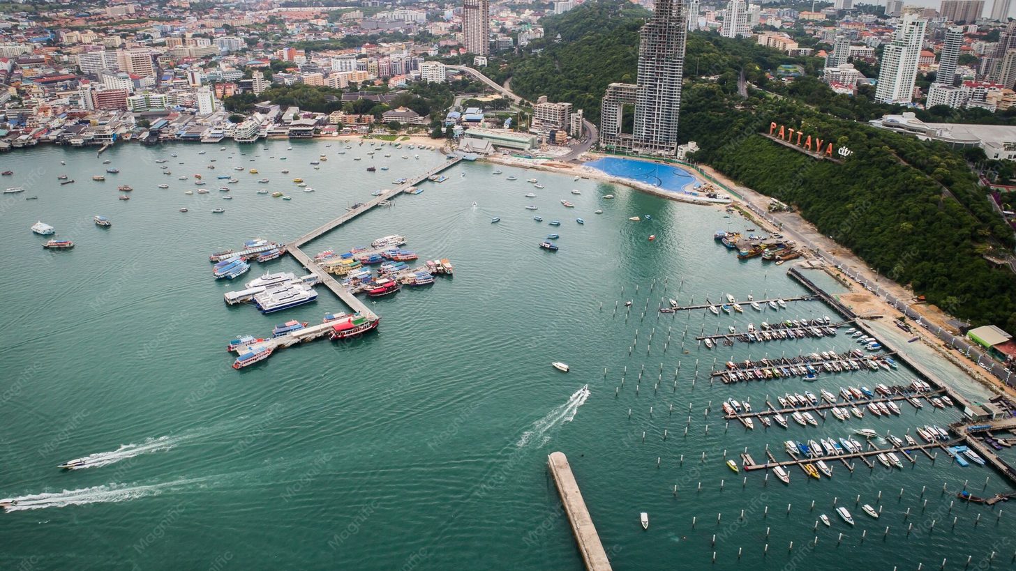 Aerial view of Pattaya Bay with boats and the city beyond