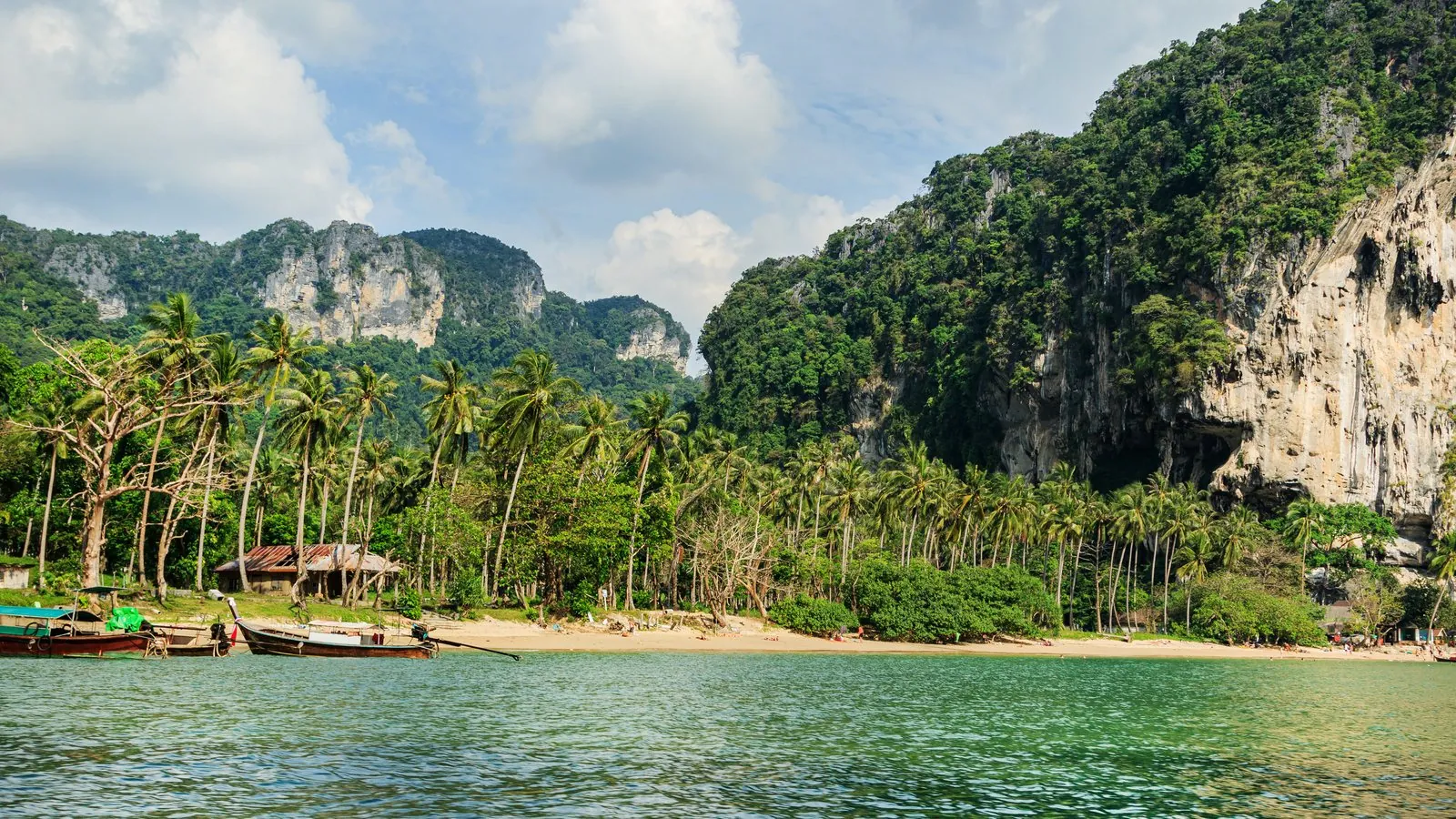 Railay beach longtail boats and cliffs, Krabi — destination weddings Thailand