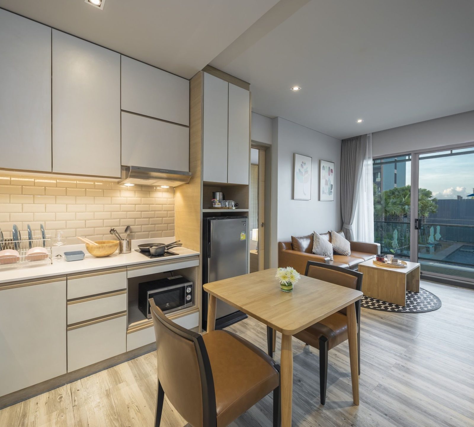 Suite living and dining area with pantry at AISANA Hotel Korat