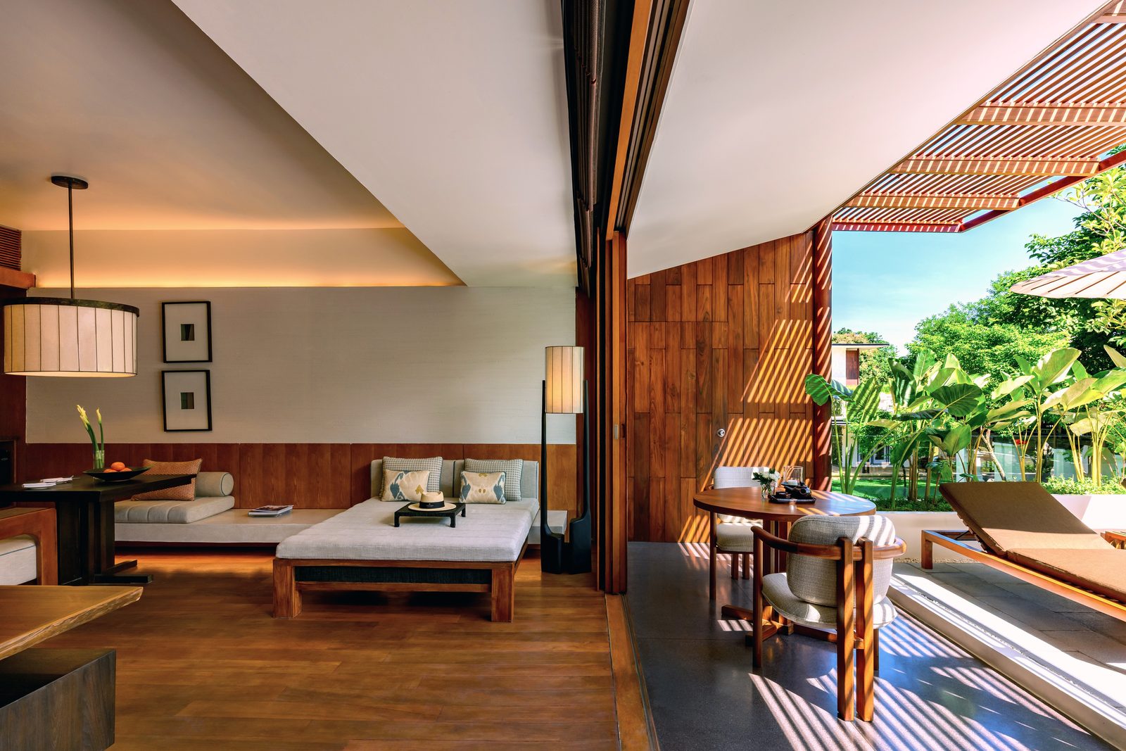 Lanna Garden Terrace Suite living area opening onto its terrace at Anantara Chiang Mai Resort
