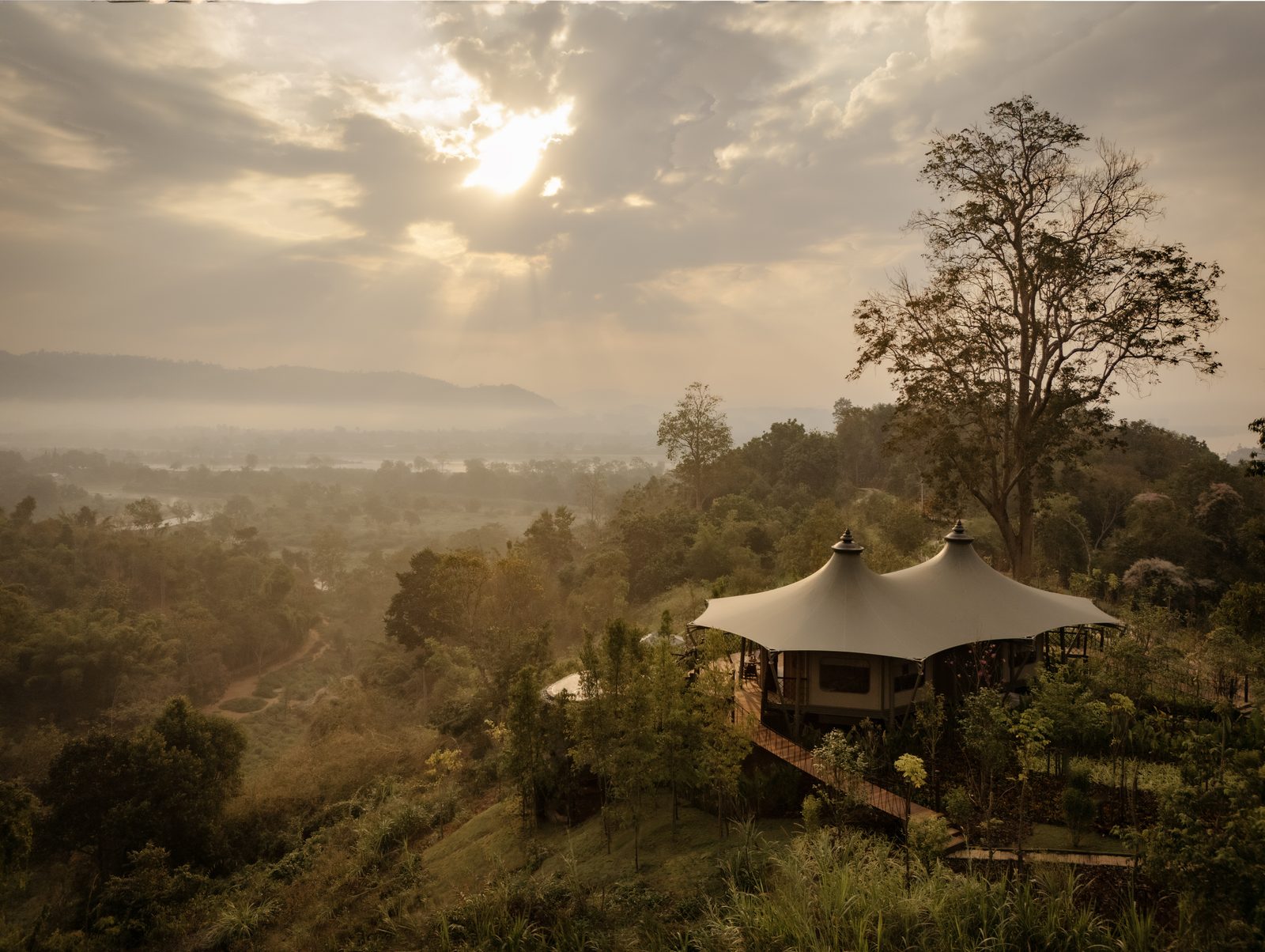 Aerial view of the Mekong Explorer Tent on the hillside at Anantara Golden Triangle