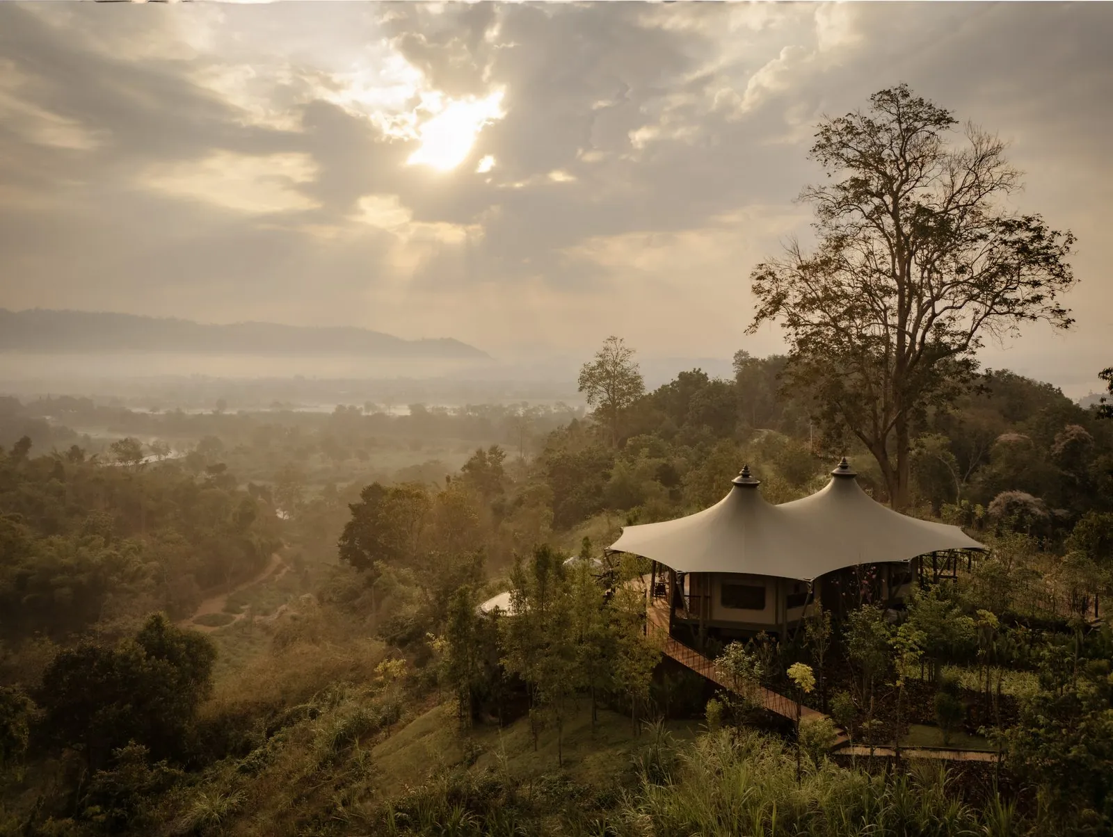 Aerial view of the Mekong Explorer Tent on the hillside at Anantara Golden Triangle