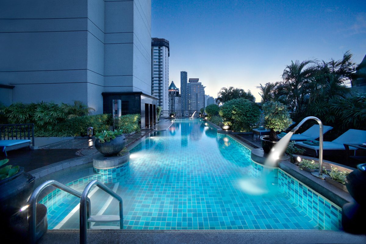 Outdoor pool on the 21st floor of Banyan Tree Bangkok at dusk