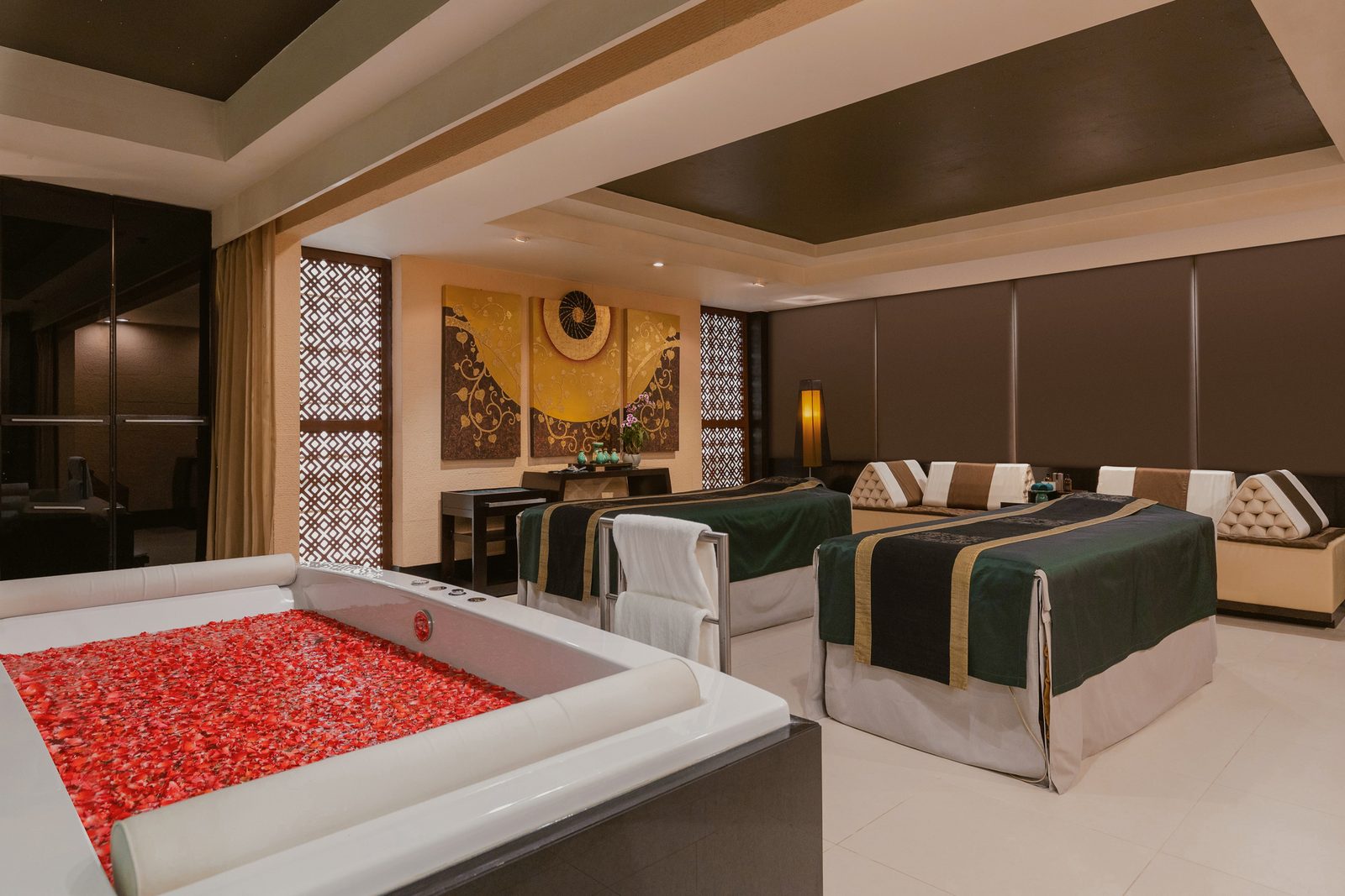 Couples treatment room with a flower bath at Banyan Tree Spa Bangkok