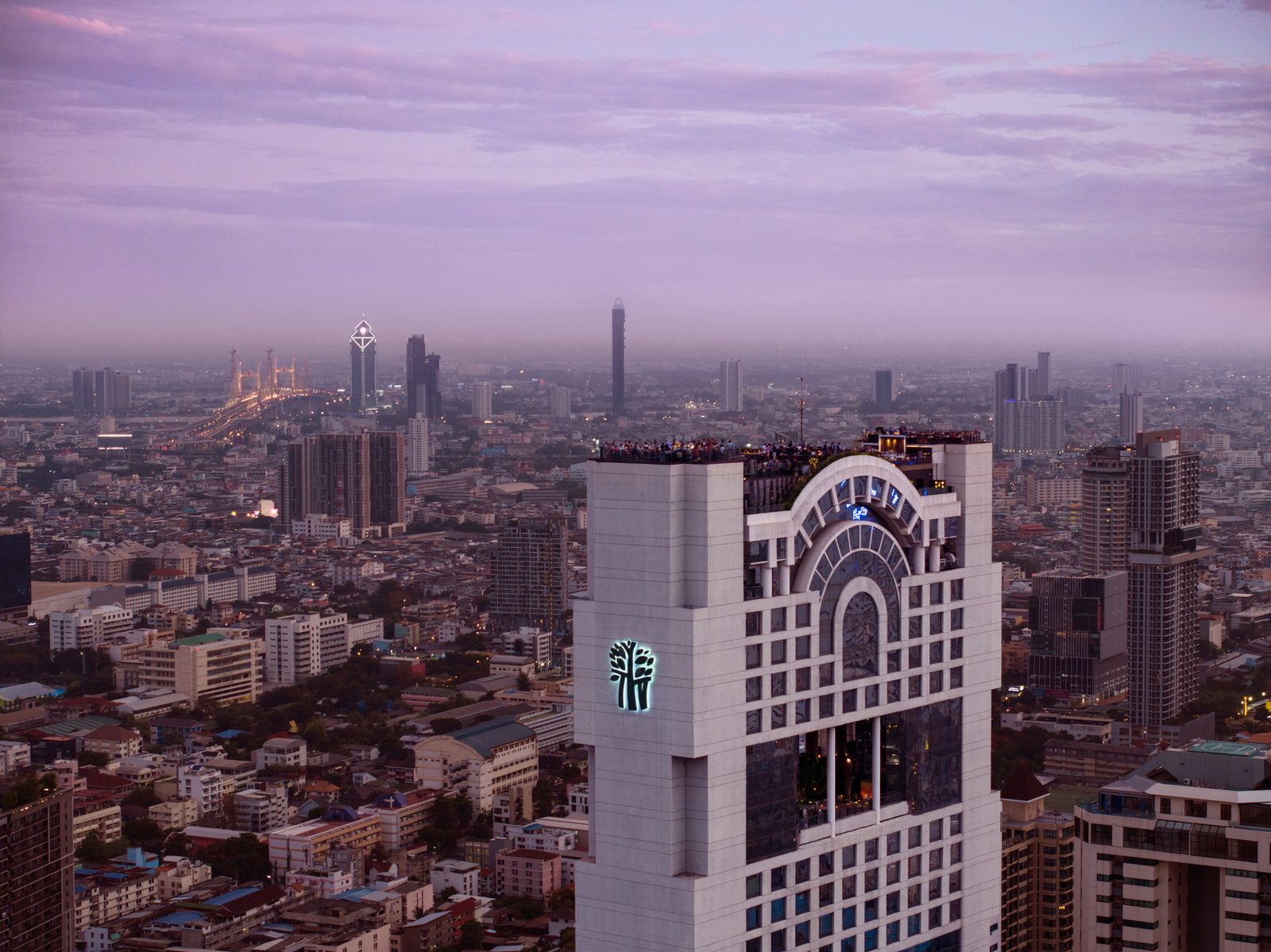 Banyan Tree Bangkok tower at dusk above the Sathorn skyline