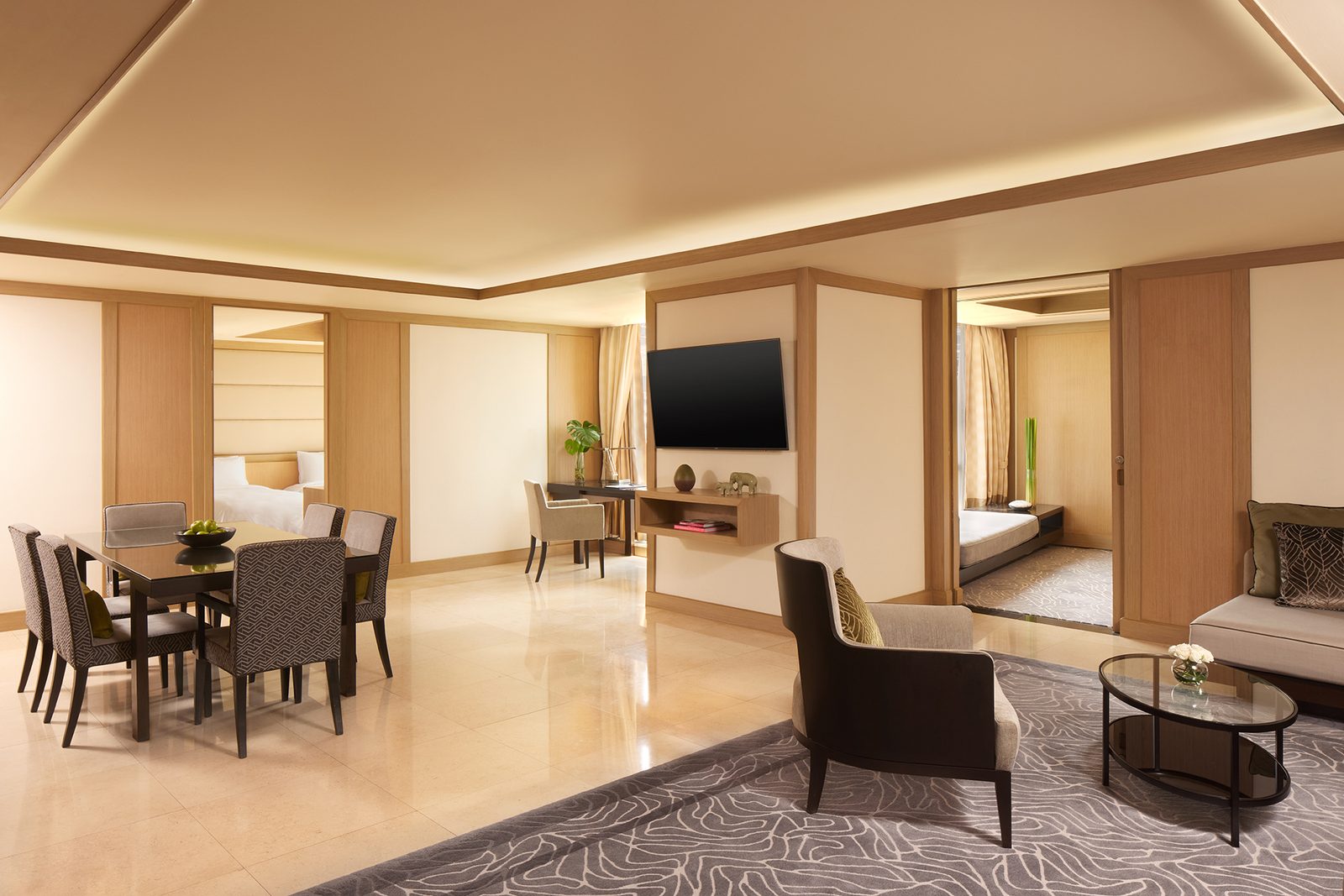 Living and dining room of the Two-Bedroom Serenity Suite at Banyan Tree Bangkok