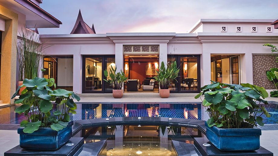 Grand Two-Bedroom Pool Villa and its pool at dusk, Banyan Tree Phuket