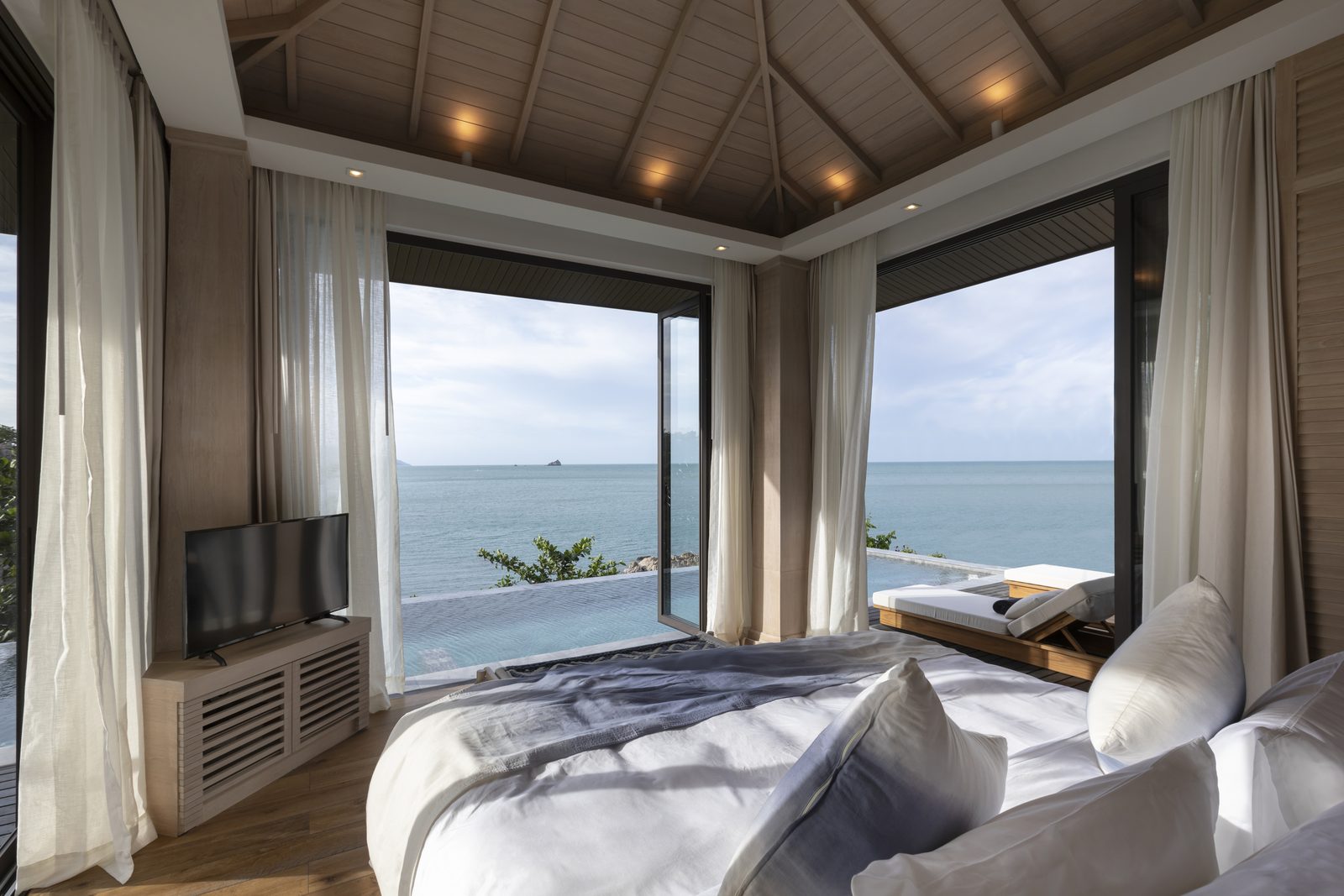 Ocean View Pool Villa bedroom with sea view at Cape Fahn Hotel, Samui