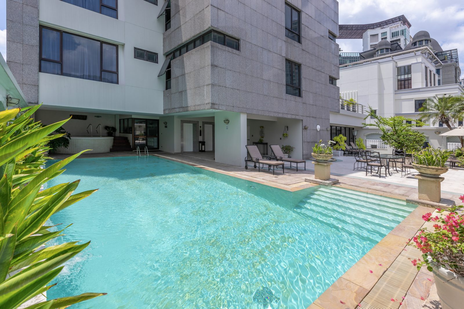 Outdoor swimming pool and sun terrace at Cape House Hotel, Soi Langsuan, Bangkok