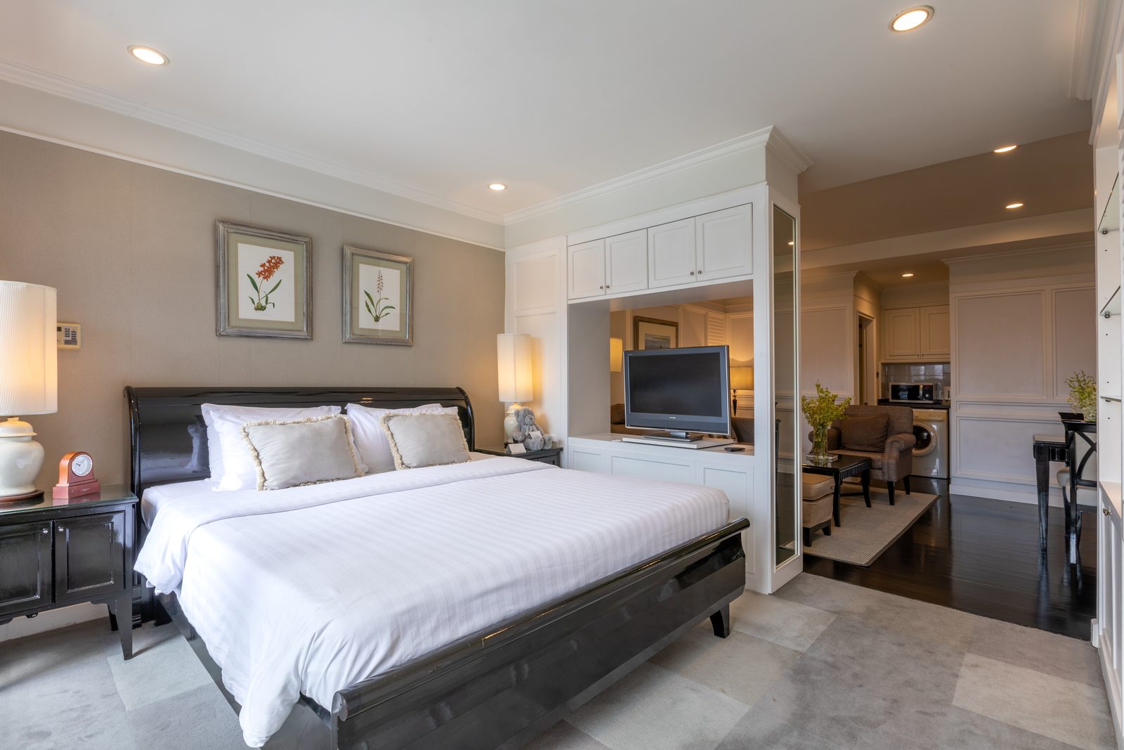Studio Suite bedroom with living area at Cape House Hotel Bangkok