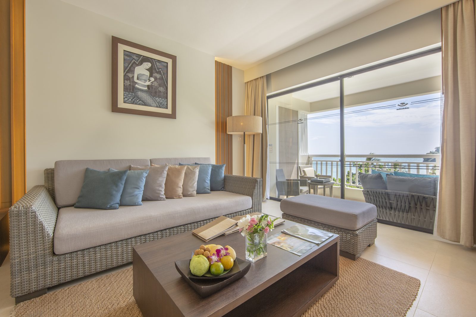 Cape Suite living area with a sea-facing balcony at Cape Panwa Hotel, Phuket